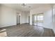 Large bedroom with plenty of natural light, closet with mirrored doors and new flooring at 9421 Wisdom Valley Ave, Las Vegas, NV 89149