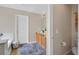 Bathroom with a single vanity and bathtub shower combination, featuring a blue and gray rug at 953 Via Del Tramonto St, Henderson, NV 89011