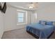 Bedroom featuring neutral paint, a ceiling fan, and a large window with a built-in bench at 953 Via Del Tramonto St, Henderson, NV 89011