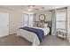 Comfortable bedroom with neutral tones, a ceiling fan, and two windows for natural light at 953 Via Del Tramonto St, Henderson, NV 89011
