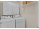Laundry room featuring white washer and dryer units and white cabinets at 953 Via Del Tramonto St, Henderson, NV 89011