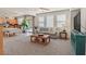 Bright living room with a cozy sofa, stylish decor, and seamless transition to dining area at 953 Via Del Tramonto St, Henderson, NV 89011