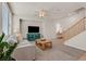 Comfortable living room offering neutral tones, ample seating, and access to staircase and other rooms at 953 Via Del Tramonto St, Henderson, NV 89011
