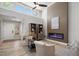 Bright, open living room with a modern fireplace and vaulted ceilings creates a cozy and inviting atmosphere at 9540 Eagle Valley Dr, Las Vegas, NV 89134