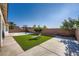 Spacious backyard features concrete and synthetic grass area with basketball hoop at , Las Vegas, NV 89149