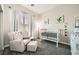 Comfortable Bedroom with crib, cushioned chair, and bright natural light at , Las Vegas, NV 89149