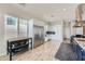 Open kitchen area with stainless steel refrigerator and range, wooden flooring and natural light at , Las Vegas, NV 89149