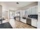 Bright kitchen featuring stainless steel appliances, wooden flooring, and white cabinets at , Las Vegas, NV 89149