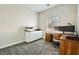 Functional home office with built-in cabinets, desk, and comfortable seating, offering a productive workspace at , Las Vegas, NV 89149