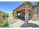 Enjoy outdoor dining on the covered patio of this easy-care backyard at 10181 Mount Harlow Ct, Las Vegas, NV 89141