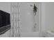 Close up of bright bathroom features a white shower and tub with white subway tile at 10181 Mount Harlow Ct, Las Vegas, NV 89141