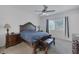 Cozy bedroom with classic wood furniture, comfortable bed, and a view to the outside at 10181 Mount Harlow Ct, Las Vegas, NV 89141