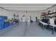 Spacious three car garage offers ample storage, epoxy flooring and an organized design at 10181 Mount Harlow Ct, Las Vegas, NV 89141