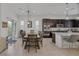 Spacious open-concept design connecting dining area to the modern kitchen with stainless steel appliances at 10181 Mount Harlow Ct, Las Vegas, NV 89141