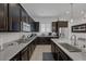 Modern kitchen with stainless steel appliances, granite countertops, and ample cabinet space for storage at 10181 Mount Harlow Ct, Las Vegas, NV 89141
