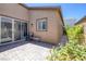 Cozy outdoor patio with brick pavers, seating area, and low-maintenance landscaping at 10181 Mount Harlow Ct, Las Vegas, NV 89141