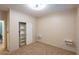 This bedroom offers plush carpeting, a built-in closet, and neutral walls at 10404 Mystic Pine Rd, Las Vegas, NV 89135