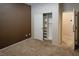 Bedroom with neutral and accent wall, carpet, and closet with shelving and hanging space at 10404 Mystic Pine Rd, Las Vegas, NV 89135