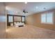 Expansive main bedroom featuring plush carpet, shuttered windows, and neutral paint at 10404 Mystic Pine Rd, Las Vegas, NV 89135