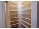 Bright walk-in closet with ample white shelving for optimal organization and storage at 10404 Mystic Pine Rd, Las Vegas, NV 89135