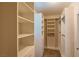 Bright walk-in closet with ample white shelving for optimal organization and storage at 10404 Mystic Pine Rd, Las Vegas, NV 89135