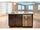 Modern kitchen island with stainless steel dishwasher, sink, and ample storage space, perfect for cooking and entertaining at 10404 Mystic Pine Rd, Las Vegas, NV 89135