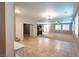 Spacious living room with tile floors, carpet, and plantation shutters, creating an inviting atmosphere at 10404 Mystic Pine Rd, Las Vegas, NV 89135