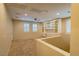 Bright and airy loft area features a built-in desk with ample storage and natural light from the window with plantation shutters at 10404 Mystic Pine Rd, Las Vegas, NV 89135