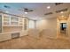 Spacious loft featuring built-in desk with storage cabinets, carpeting, recessed lighting, and window with plantation shutters at 10404 Mystic Pine Rd, Las Vegas, NV 89135