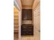 Walk in pantry featuring hardwood floors, granite countertops, and shelving on the left at 10404 Mystic Pine Rd, Las Vegas, NV 89135