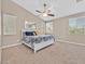 Bright bedroom featuring a ceiling fan and large windows that provide plenty of natural light at 10673 Bonchester Hill St, Las Vegas, NV 89141