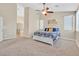 Well-lit bedroom that features a view of an ensuite bathroom at 10673 Bonchester Hill St, Las Vegas, NV 89141