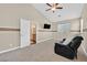 A bonus room with neutral carpeting and paint perfect for relaxing or a home theater at 10673 Bonchester Hill St, Las Vegas, NV 89141
