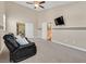 A bonus room with neutral carpeting and paint perfect for relaxing or a home theater at 10673 Bonchester Hill St, Las Vegas, NV 89141
