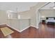 Open hallway with hardwood floors leads to bedrooms at 10673 Bonchester Hill St, Las Vegas, NV 89141