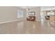 Comfortable living room with tile flooring and a view of the staircase at 10673 Bonchester Hill St, Las Vegas, NV 89141