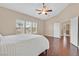 Spacious main bedroom features wood floors, vaulted ceiling, and plenty of natural light at 10673 Bonchester Hill St, Las Vegas, NV 89141