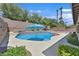 Beautiful backyard pool with mature landscaping, perfect for outdoor entertaining at 10673 Bonchester Hill St, Las Vegas, NV 89141
