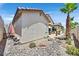 Landscaped backyard with rock garden and patio, perfect for outdoor relaxation and entertainment at 10701 Morning Harbor Ave, Las Vegas, NV 89129