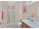 Bathroom featuring shower, sink, and artwork at 10701 Morning Harbor Ave, Las Vegas, NV 89129
