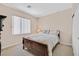 Comfortable bedroom with window, closet, and a bed at 10701 Morning Harbor Ave, Las Vegas, NV 89129