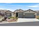 Charming home features a low maintenance front yard and a two-car garage at 10701 Morning Harbor Ave, Las Vegas, NV 89129