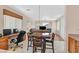 Bright living room boasts a fireplace, cozy seating, and seamless flow into the dining area at 10701 Morning Harbor Ave, Las Vegas, NV 89129
