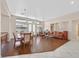 Open living area features wood floors, a large window, and comfortable furniture at 10701 Morning Harbor Ave, Las Vegas, NV 89129