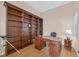 Dedicated office space featuring built-in shelving and desk, perfect for work or study at 10701 Morning Harbor Ave, Las Vegas, NV 89129