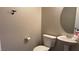 Cozy half bathroom with pedestal sink and unique whale tail hook at 10804 Mason Hill Ave, Las Vegas, NV 89166