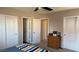 Bedroom with two closets and an assortment of doors leading to other rooms at 10804 Mason Hill Ave, Las Vegas, NV 89166