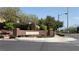 Community entrance sign for Manchester and Providence Park with lush landscaping and mountain views at 10804 Mason Hill Ave, Las Vegas, NV 89166