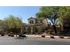 Charming two-story home with a well-manicured front yard and mature trees at 10804 Mason Hill Ave, Las Vegas, NV 89166