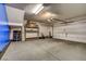Spacious two-car garage with epoxy flooring, an automatic door, and plenty of room for storage at 10804 Mason Hill Ave, Las Vegas, NV 89166